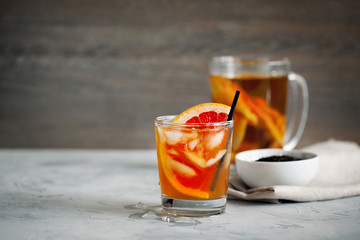 Refreshing healthy cocktail of fermented raw kombucha tea with a slice of grapefruit and ices with copy space for text.Kombucha mushroom tea is a natural fermented drink originally from China.
