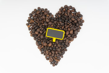 Coffee beans and chalk board closeup with selective focus. Copy space concept