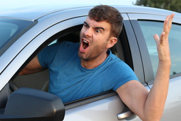 Angry man driving a car 