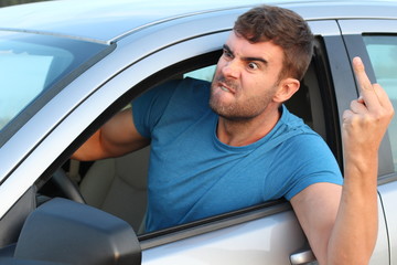 Angry driver showing middle finger