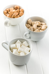White and brown sugar cubes.