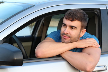 Relaxed car driver looking at view