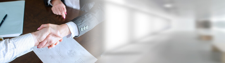 Business people shaking hands; panoramic banner
