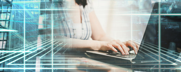 Female hands using a laptop; multiple exposure