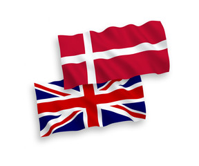 National vector fabric wave flags of Great Britain and Denmark isolated on white background. 1 to 2 proportion.