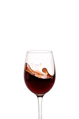 splash of red wine in glass isolated on white background.