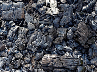 black coals of a burned-out fire. background