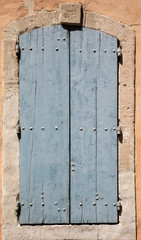 Old  stone house with  wooden shutters, Provence, France.