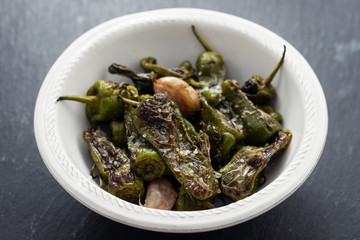 typical spanish food grilled green pepper with salt on dish
