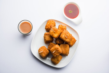Crispy Paneer popcorn is a popular party snack and an appetiser. selective focus