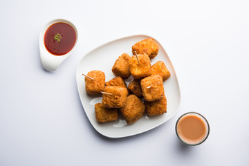 Crispy Paneer popcorn is a popular party snack and an appetiser. selective focus