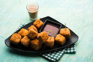 Crispy Paneer popcorn is a popular party snack and an appetiser. selective focus