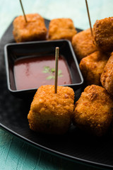 Crispy Paneer popcorn is a popular party snack and an appetiser. selective focus