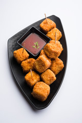 Crispy Paneer popcorn is a popular party snack and an appetiser. selective focus