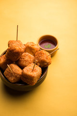 Crispy Paneer popcorn is a popular party snack and an appetiser. selective focus