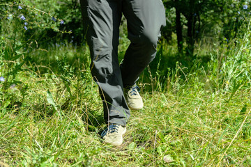 Feet of a man running in nature for background