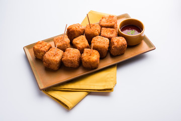 Crispy Paneer popcorn is a popular party snack and an appetiser. selective focus