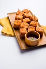 Crispy Paneer popcorn is a popular party snack and an appetiser. selective focus