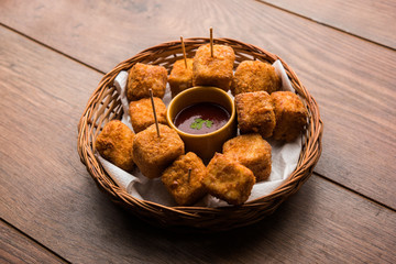 Crispy Paneer popcorn is a popular party snack and an appetiser. selective focus