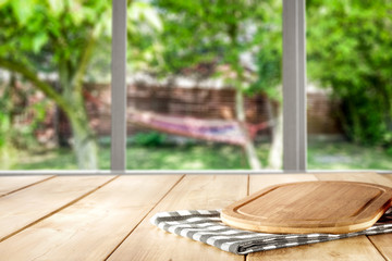Table background with a nature behind the window