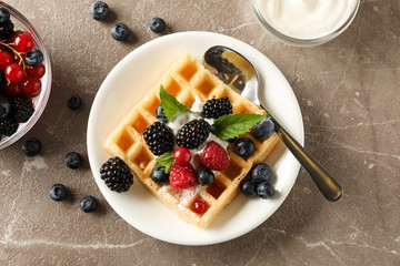 Composition of breakfast with belgian waffles, top view