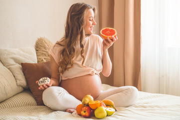 Pregnancy and healthy organic nutrition. Pregnancy and food choice. Pregnant woman enjoying fresh...