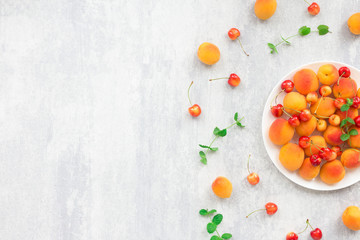 Summer fruits on grey background, flat lay, top view