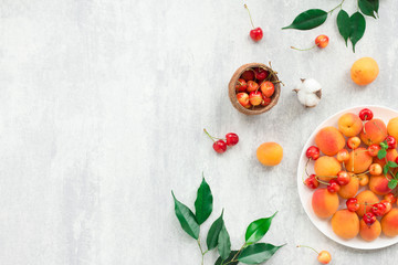 Summer fruits on grey background, flat lay, top view