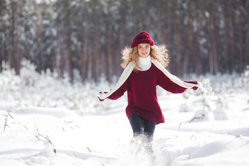 Young beautiful woman having fun in winter time outdoors