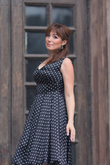 Fototapeta premium Beautiful caucasian woman posing dressed in retro style