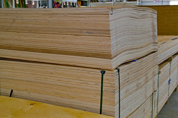 Sheets of plywood laid in the warehouse store. Materials for construction.
