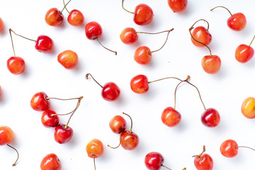 Obraz na płótnie Canvas Top view image of fresh ripe red cherries isolated on white background