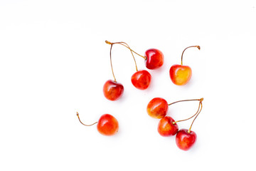 Fototapeta na wymiar Top view image of bucnhes of fresh ripe red cherries isolated on white background