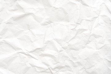 Modern crumpled white paper on empty sheet gray background with light shadows for creative...