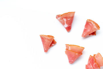 Thin ham slices isolated on white background. Snack idea