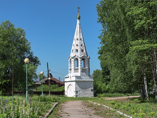Fototapeta na wymiar Belfry of Presentation Church in Bezhetsk, Russia. The belfry, built in 1680-1682, is the oldest surviving town's building and the only existing part of Monastery of Presentation of Virgin Mary.