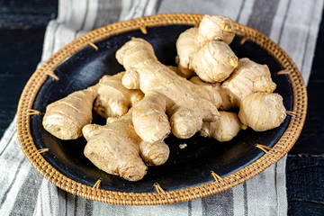 Fresh ginger roots close up on linnen napkin background