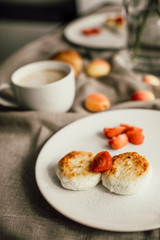 Tasty breakfast cheesecakes with coffee. Cheese pancakes