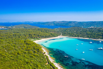 Aerial view of sailing boats in a beautiful azure turquoise lagoon on Sakarun beach on Dugi Otok...