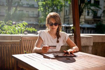 Young woman Paying online with credi card