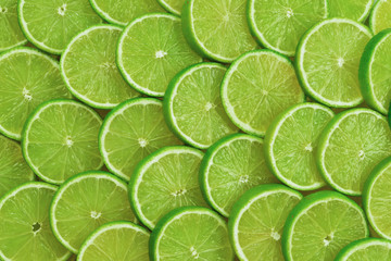Fresh lime slices as a background.