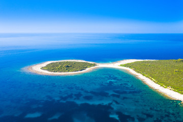 Rocky fish shaped cape in turquoise sea, clear blue water on the island of Dugi Otok in Croatia