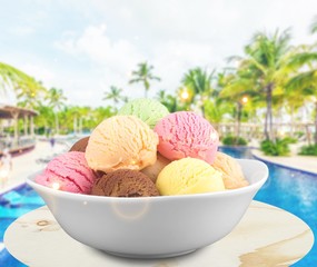 Ice cream scoops in bowl on white background