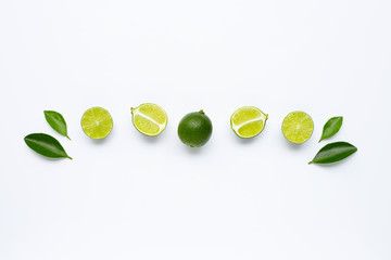 Fresh limes with leaves isolated on white
