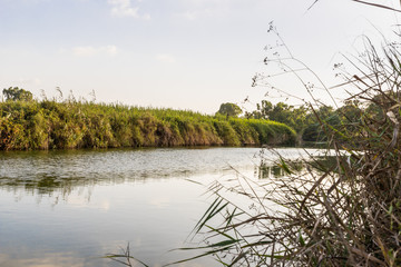Panoramic  view in the rays of the setting sun over the Alexander River near Kfar Vitkin, in northern Israel