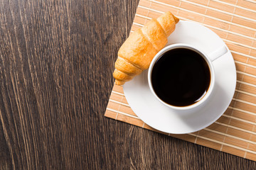 Cup of espresso coffee on wooden table