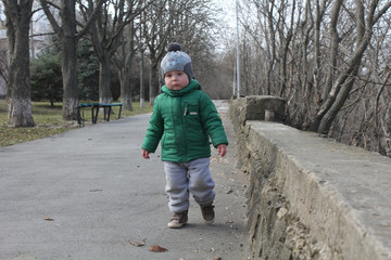 Cute child walking in the park with good air for the kid.