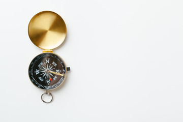 Golden vintage compass isolated on white background