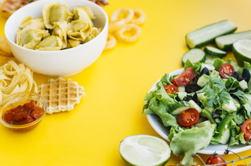 Healthy food vs unhealthy food on yellow table