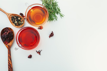 Tea in a glass cup with spices and herbs. Top view.